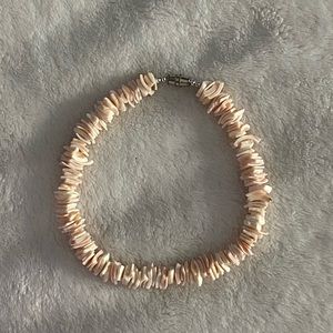 Vintage shell bracelet never used, non damaged & has a twist on clasp